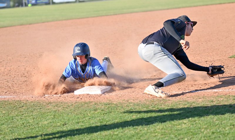 Triz Willey gets down and dirty as he slides safely into third.