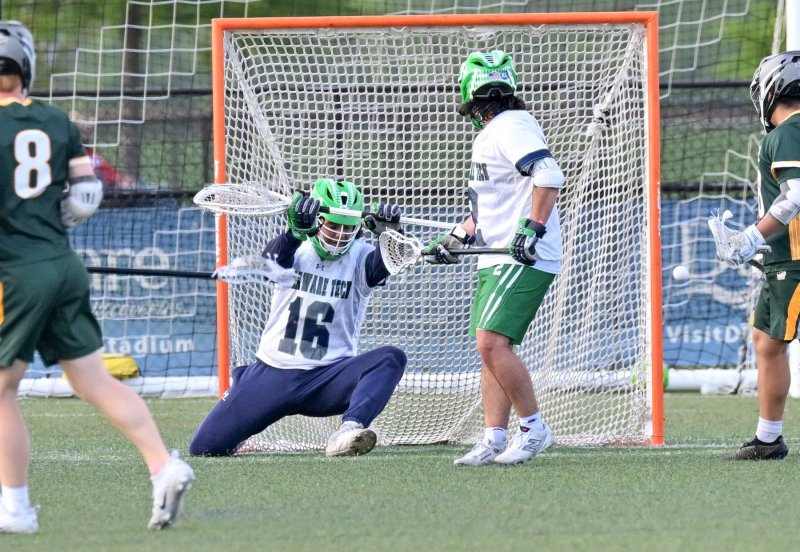 Goalie Jaden Parker (Dover) makes a save in the first quarter.