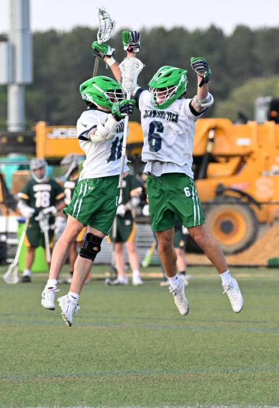 Del Tech’s Caleb Palumbo, left, (Wilmington Christian) celebrates his goal with Landon Hudson (Milford).