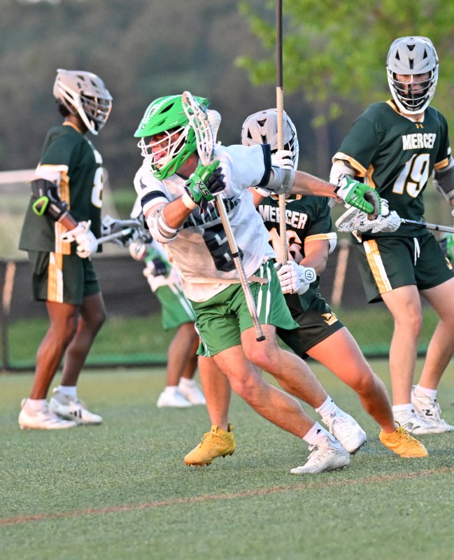 Del Tech midfielder Landon Hudson (Milford) dodges past the Mercer defense.