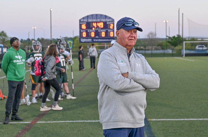 Longtime coach Bill Gorrow, right, with 49 years of lacrosse coaching experience, proudly watched as the final minutes ticked off the clock. The game came exactly three months after the passing of his daughter. In her honor, the Delaware Tech team wore blue KG stickers on their helmets to commemorate Kaitlin and presented Gorrow with the game ball after the win.
