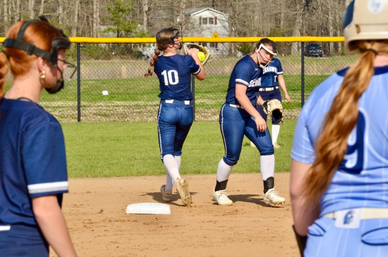 Seahawks junior Grayce Glover ducks out of the way so Danica Bergh can haul in a fly ball.