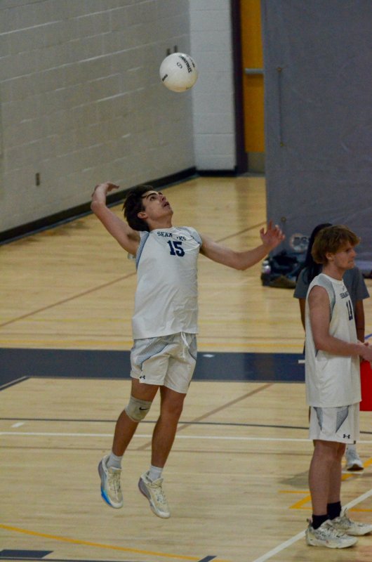 Seahawks senior Vito Barone hops up on a serve.