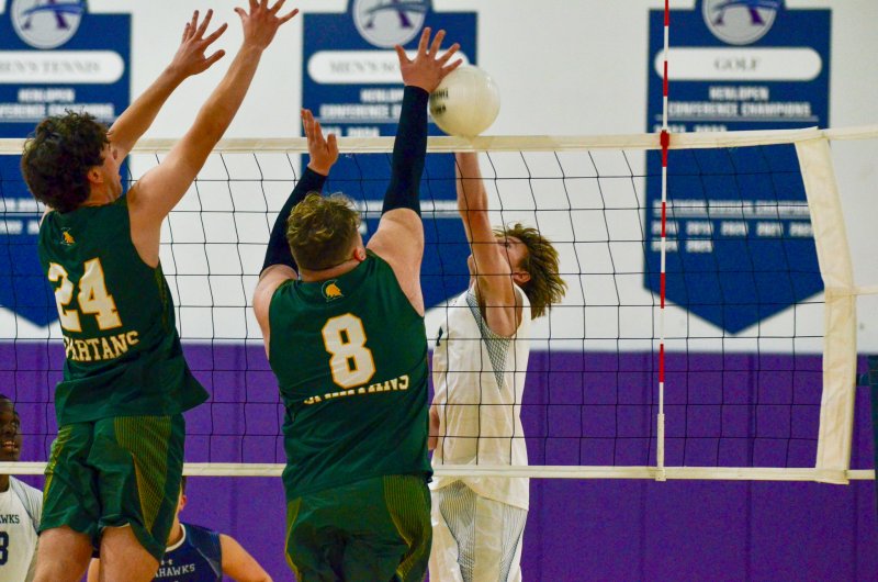 Seahawks junior Desmond Davis squeaks one past a tough Saint Mark’s block.