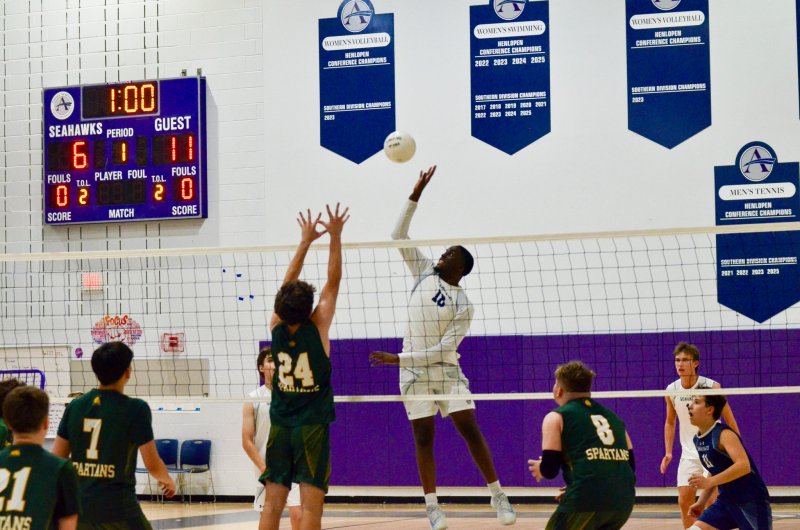 Sussex Academy junior Jovan Jean-Louis flies up for a kill.
