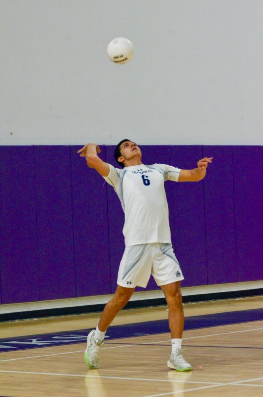 Seahawks senior Christian Wright serves the ball.
