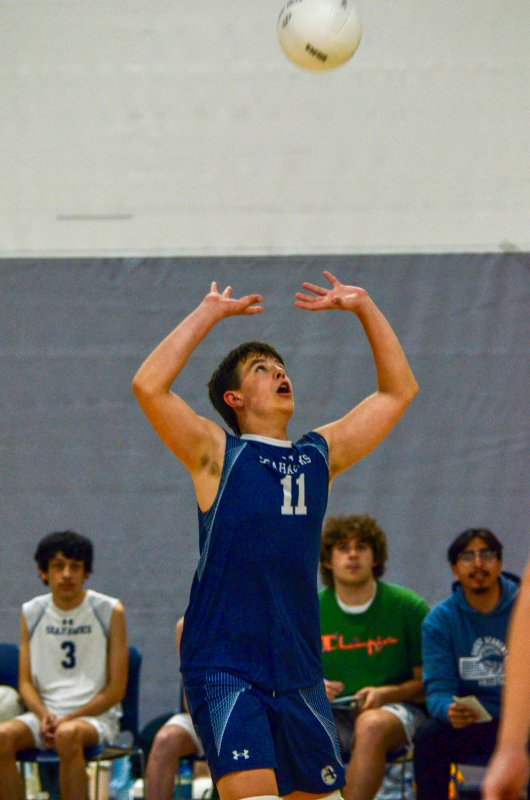 Seahawks sophomore Ethan Evans sets the ball.