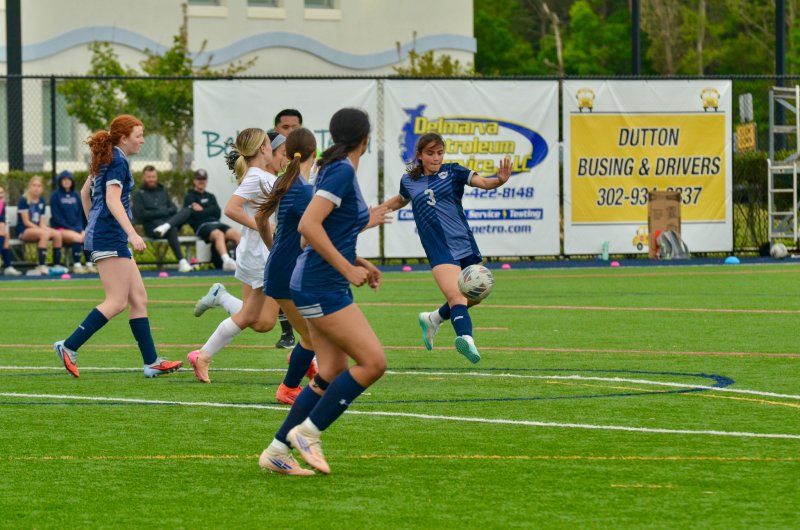 Sussex Academy freshman Patty Lara Nieto takes a shot with the ball bouncing.
