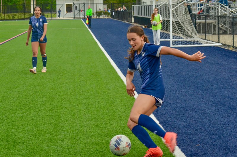 Sussex Academy eighth-grader Garrity Cox controls the ball in the corner.