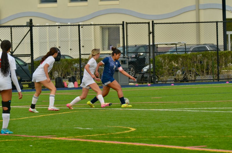 Sussex Academy senior Yuvia Velasquez-Juarez tries to turn the corner.