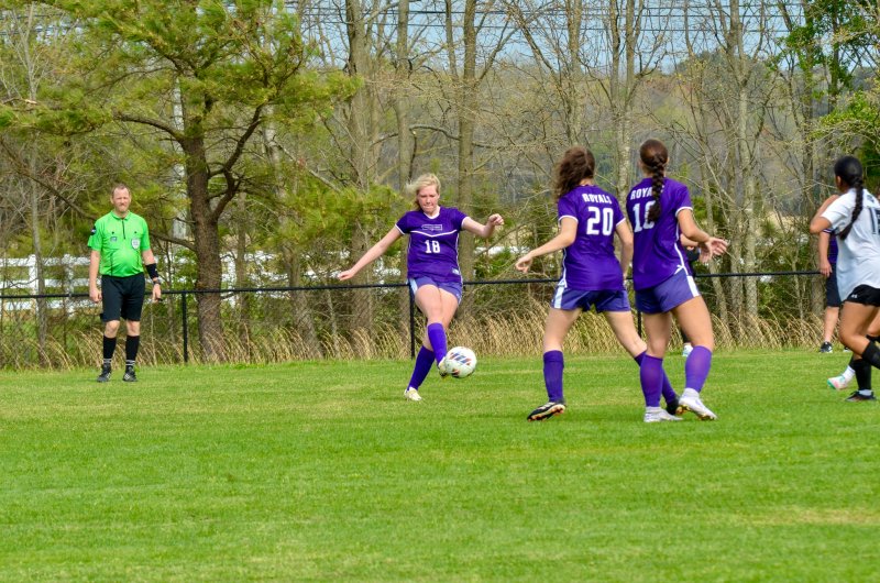 Royals junior Addison Hayes boots the ball.