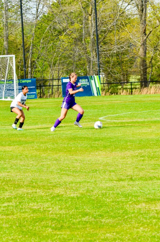 Royals sophomore Morgan Stevenson crosses midfield.