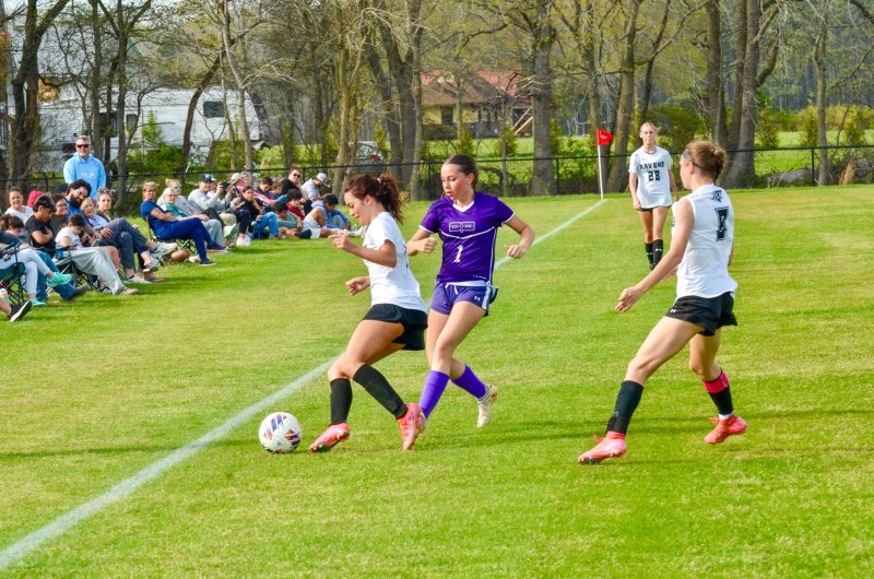 Delmarva Christian senior Haley Jones presses for the ball along the sideline.