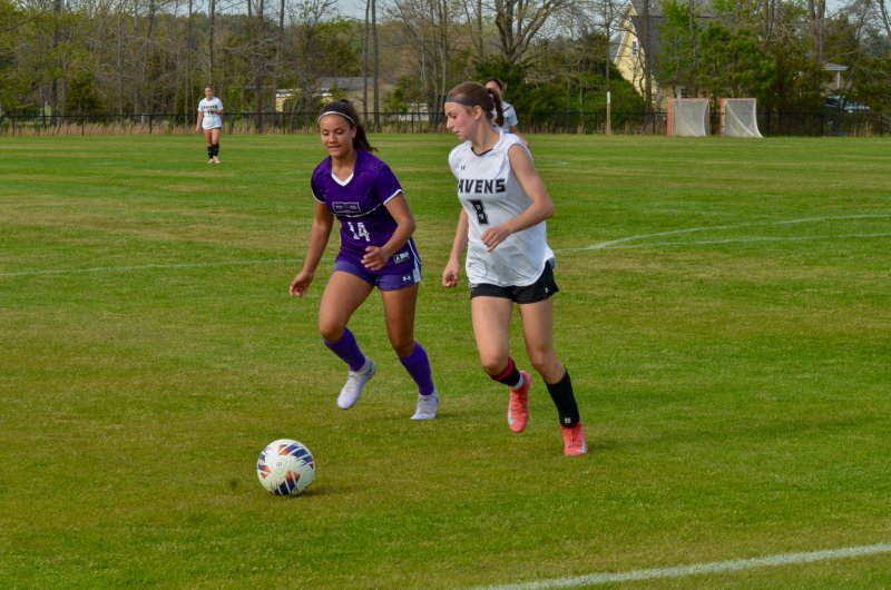 Sussex Tech junior Ava Ruscavage begins to commandeer the ball from Anaiah Mulhern.