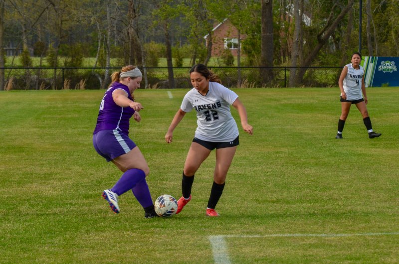 Delmarva Christian senior Emelia Faubert battles for the ball with Yaretzi Garcia Vivar.