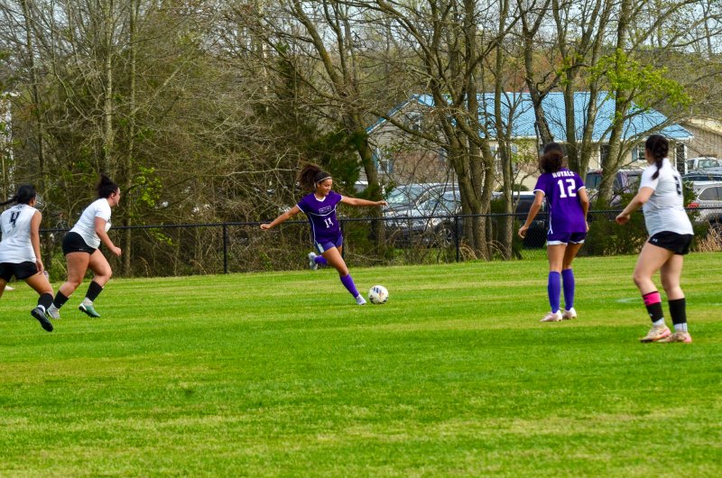 Delmarva Christian freshman Anaiah Mulhern begins to cross the ball.