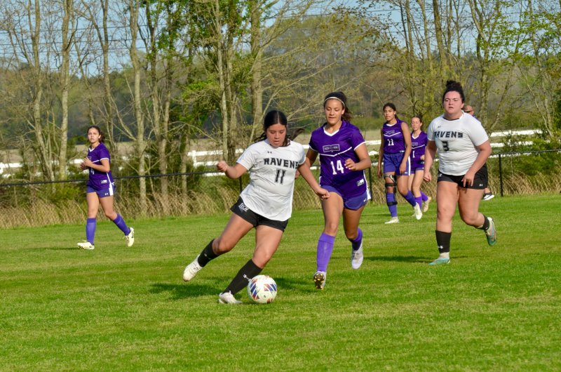Sussex Tech senior Yasmin Navarro Lopez clears the ball away from a pressing Anaiah Mulhern during the Ravens’ 7-0 win April 13. AARON R. MUSHRUSH PHOTOS