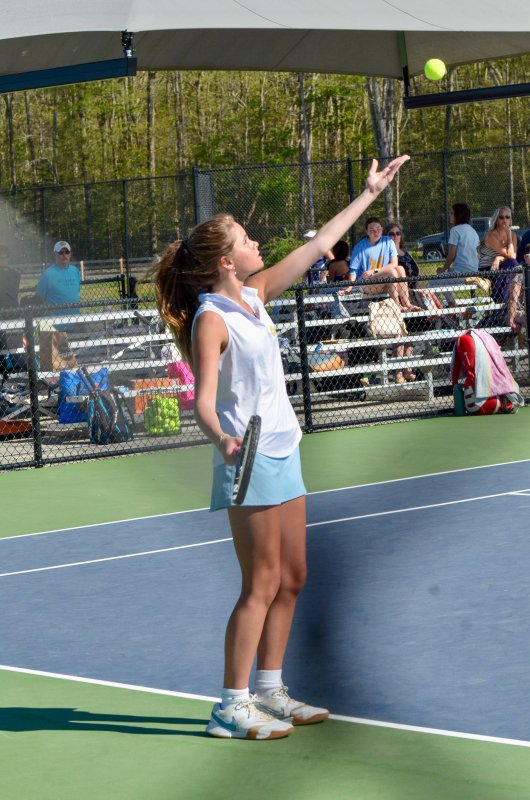 Cape junior Julia DiSabatino serves the ball in first singles.