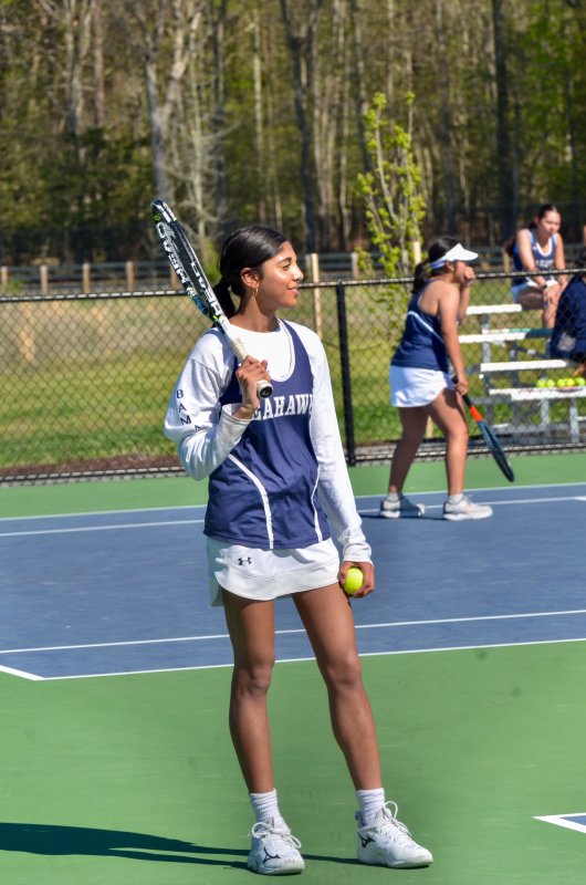 Seahawks sophomore Audrey Gulab smiles before serving.