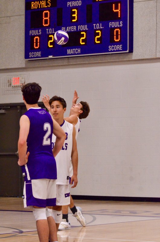 Delmarva Christian senior James Baxter serves the ball.