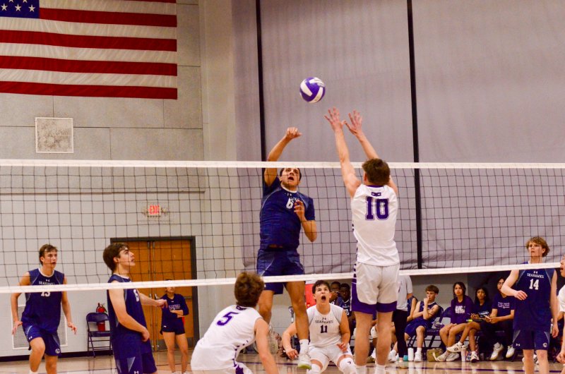 Sussex Academy senior Christian Wright tries to beat the block.