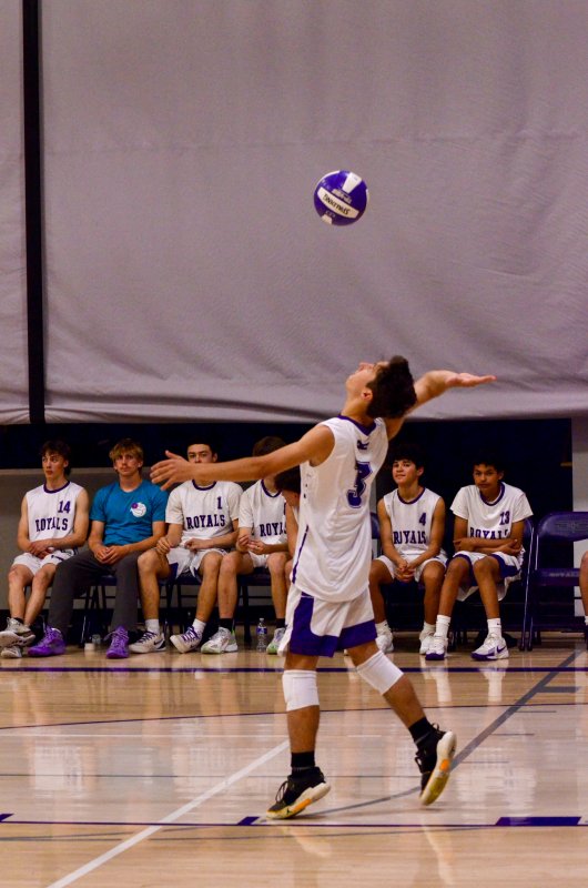 Delmarva Christian sophomore Rowan Dukes focuses on his serve,