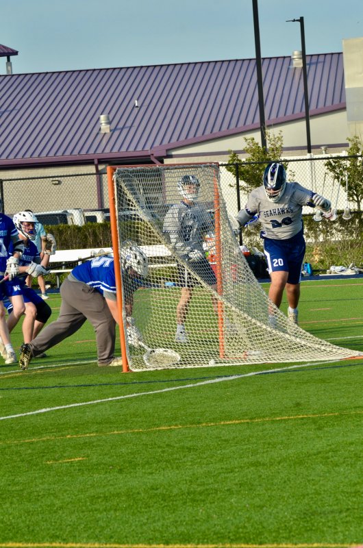 Seahawks sophomore Ty Jarrell begins to celebrate the hockey goal he scored against Woodbridge.
