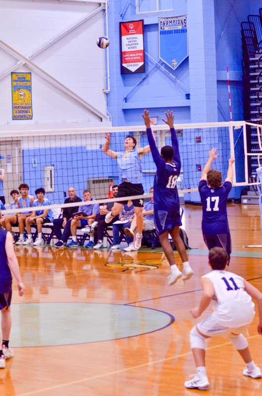 Cape senior Kingston Davis rises up to try and beat the block.