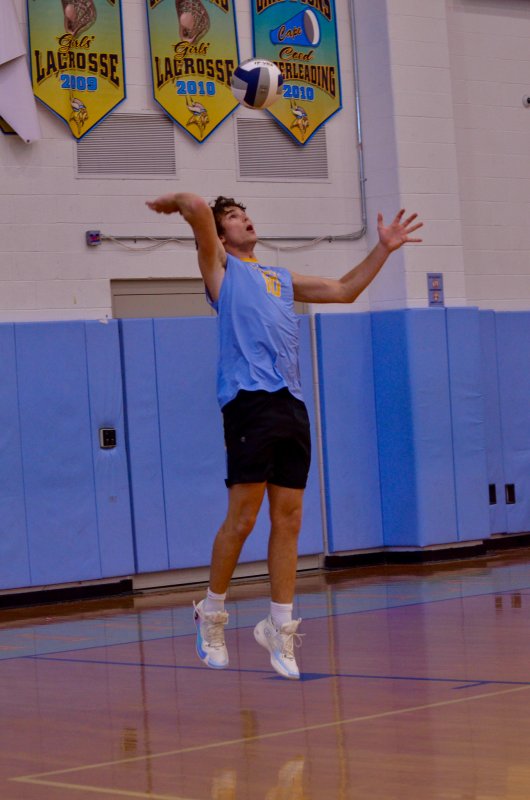 Cape senior Jason Harpel-Rickards hops up for a serve.