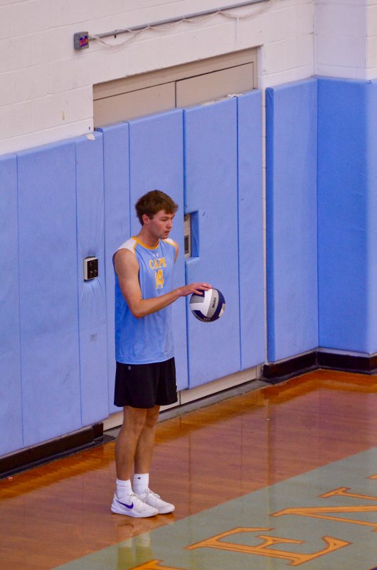 Cape senior Lawson Whaley dribbles the ball before serving it.