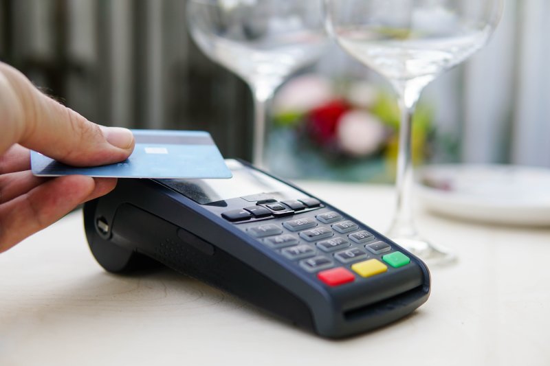 A bill that would separate fees for tips from sales on credit cards awaits action in the House. SOURCE: ADOBE STOCK/GLEBCALLFIVES