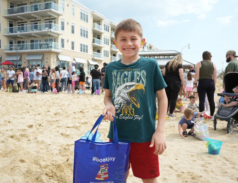 Simon Dorsey proudly holds up his bag of Easter eggs after the egg scoop.