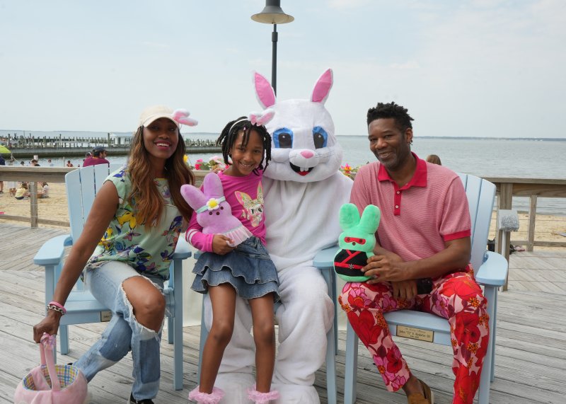 The Webb family enjoys a special appearance from the Easter Bunny. Shown are (l-r) Delicia, 8-year-old Amanda, and Michael.