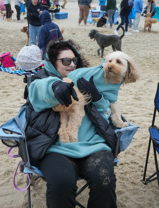 Kristen Corvino and her dog Luna wear matching hoodies that say, “You matter.” The two traveled from Baltimore to attend the event, their second ever. ELLEN MCINTYRE PHOTO
