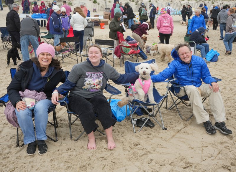 The Hiller family traveled from Rockville, Md., with their dog, Sweetie, for the Doodles in Dewey weekend. Shown are Pamela, Emily, Sweetie and Keith. ELLEN MCINTYRE PHOTO