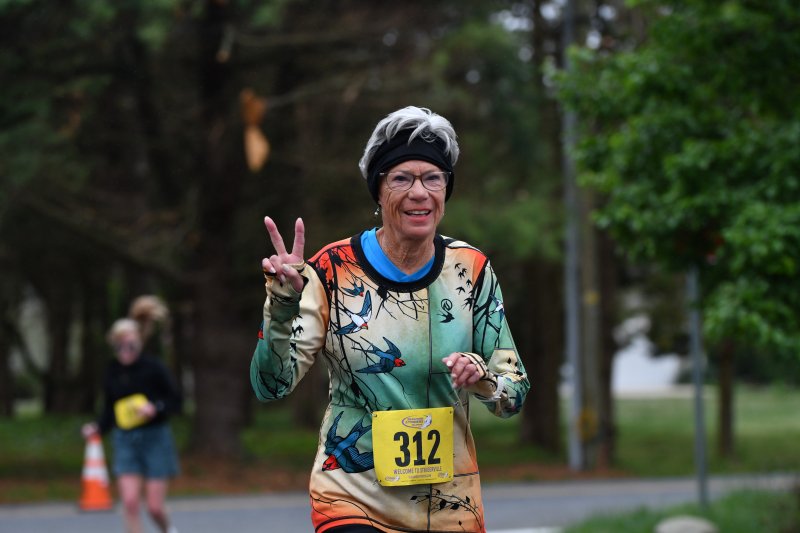April Anderson, 81, wins her age group in 49:34.