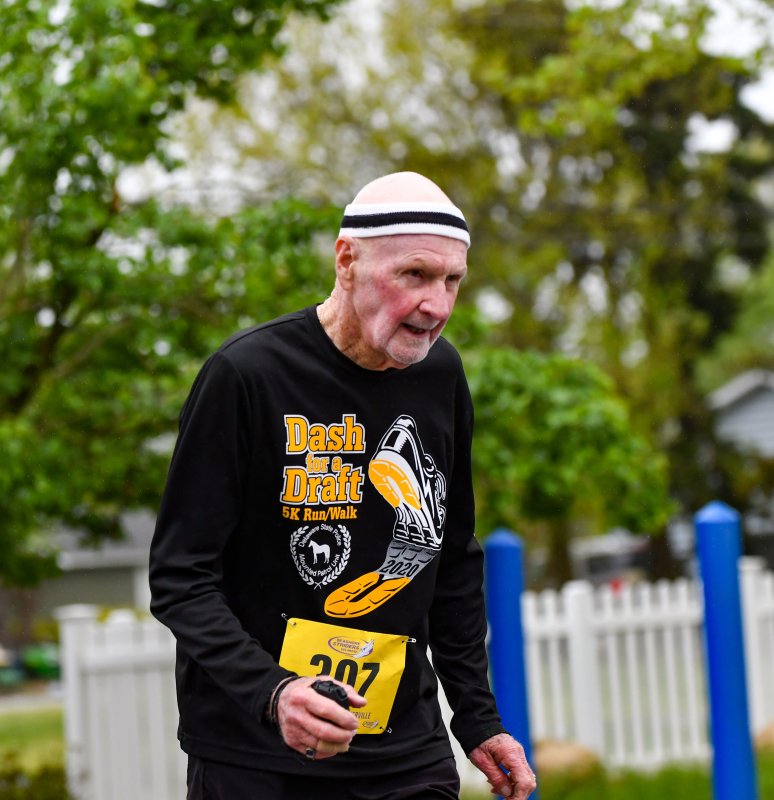Alan Firlein, 87, takes second in his age group in 49:48.