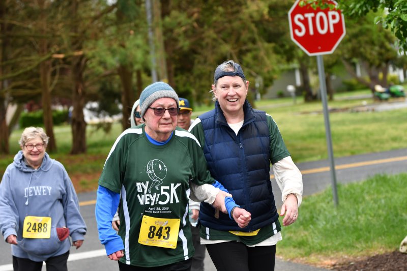 Bernie, 85, and Kathleen Gallagher cross the finish line in 1:00.18.