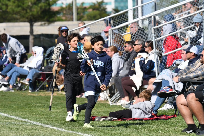 Atlantic Lacrosse players leave the Fred Thomas-versus-Beacon game to go practice. DAVE FREDERICK PHOTO
