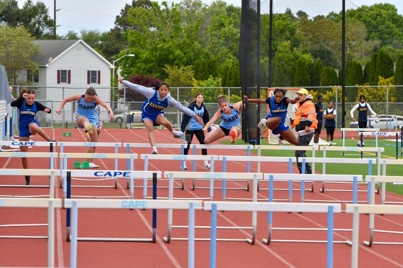 Middle school girls compete in the hurdles. DAVE FREDERICK PHOTO