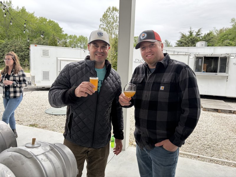 Matt Dahl, left, and Don Lewis of Denton, Md.-based Eden Town Brewing, show off their Porch Crusher hefeweizen.