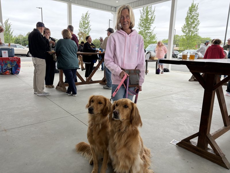 Amy Thomas enjoys Firkin Fest with her four-legged friends, Autumn, left, and Aurora.