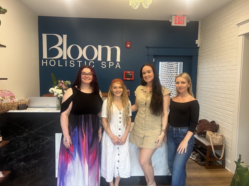 Bloom Holistic Spa staff (l-r) Oryan Anderson, Kylie Rineholt, owner Ryan Smith and Vera Makaranka are shown at the front desk of the spa’s Second Street location in Lewes. GABRIELLE ZIEGLER PHOTOS