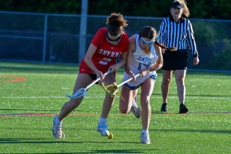 Daisy Hughes battle for a ground ball.